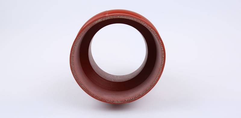One red silicone hump hose cross section is shown in the picture, and you can see the reinforcing steel wires in the tube.