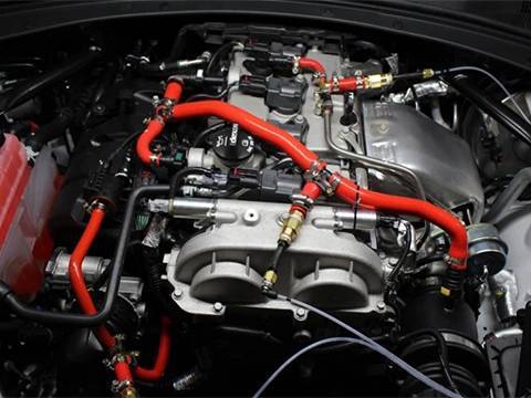 Red car silicone hose kits are installed on the engine of Audi.