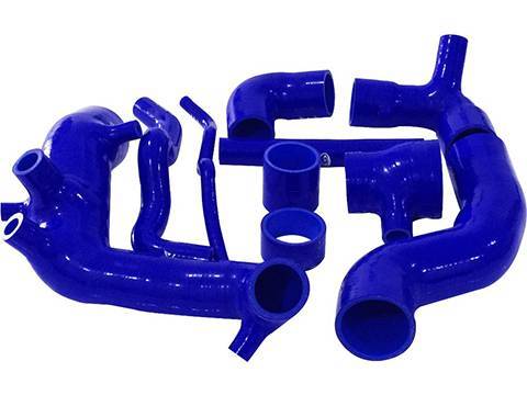 Several different shapes of blue silicone elbows on white background.