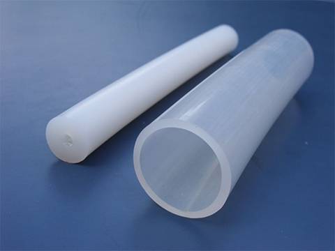 Two different thicknesses of food grade silicone hose on blue background.