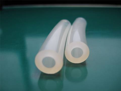 Two food grade silicone hose on the table with transparent surface.