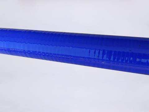 A blue color heat resistant silicone hose on gray background.