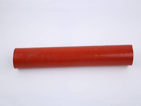 A red color heat resistant silicone hose on gray background.