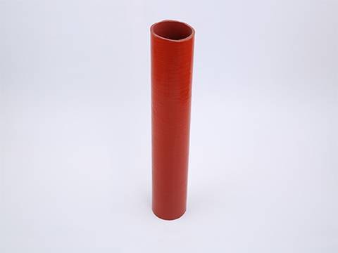 A red color heat resistant silicone tubing standing on gray background.