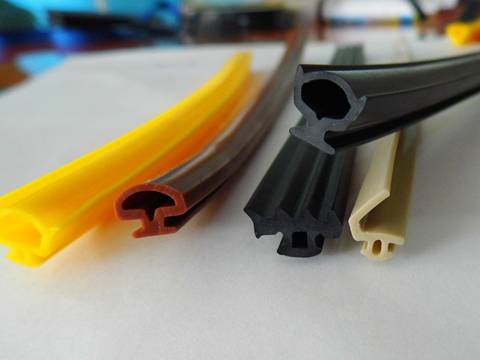 Five silicone strip on the white paper with different colors.